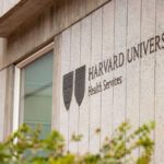 Harvard University Health Services building sign and emblem