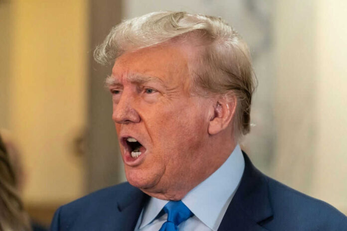 Man speaking with mouth open in a suit