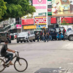 Group of people near vehicles on city street