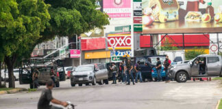 Group of people near vehicles on city street