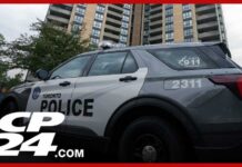 Police officer shot and killed while executing search warrant at Toronto apartment building