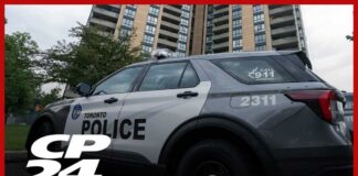 Police officer shot and killed while executing search warrant at Toronto apartment building